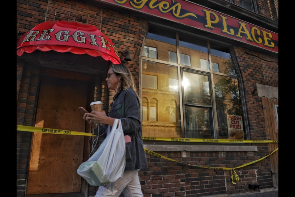 Reggie's Place Tavern remains taped off this morning after a fire on Sunday that caused the evacuation of a number of apartment residents. Michael Purvis/SooToday