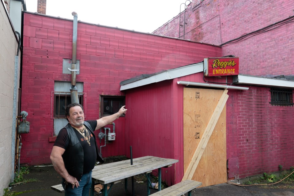 Reggie's Place Tavern bar-owner Reggie Daigle said he believes thieves moved a picnic table, jumped on his roof, and then kicked in second-story boarded up windows to enter his bar and steal liquor and beer. Since his bar caught fire on July 30, he's had around eight or nine break-ins. Jeff Klassen/SooToday