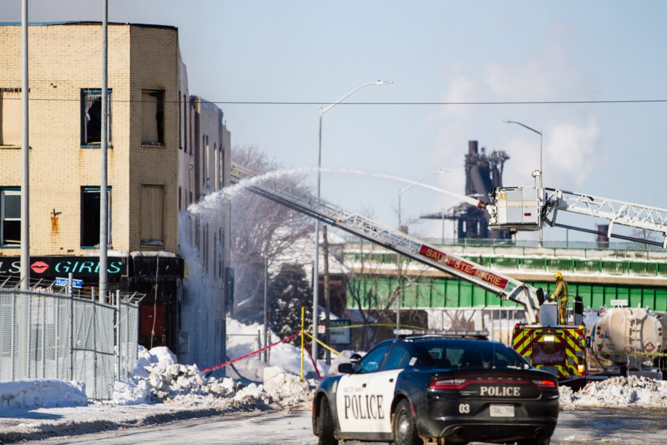Firefighters remain at the scene of a fire that broke out early Monday morning at The Dime, formerly Studio 10, on Queen Street West. Donna Hopper/SooToday