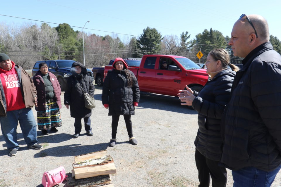 Garden River First Nation Chief Karen Bell and councillor Travis Jones, right, speaks with community members who are demanding answers from band council about the disbursement of the forthcoming Robinson Huron Treaty annuities settlement for past compensation.  