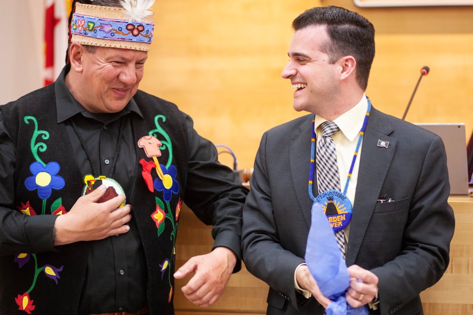 Chief Mark McCoy of Batchewana First Nation and Sault Ste. Marie Mayor Matthew Shoemaker share a laugh after a presentation Monday at the Ronald A. Irwin Civic Centre.