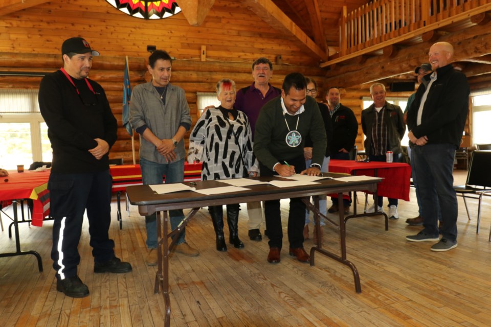 Garden River First Nation Chief Andy Rickard signs a memorandum of understanding Thursday between Garden River, Shwe Miikaan and Miller Paving for the resurfacing of Highway 17 and Highway 17B, which run through the First Nation. The signing ceremony was held at the Garden River Community Centre. James Hopkin/SooToday 