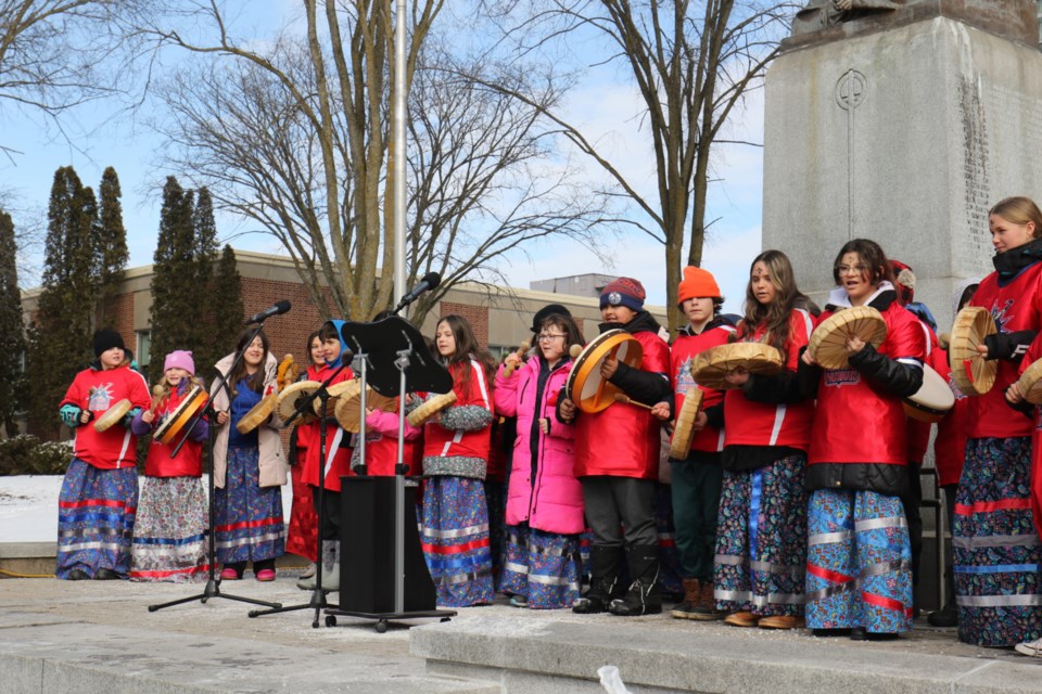A group of children sing and drum to open this year's memorial march for missing and murdered Indigenous women, girls and gender-diverse individuals outside of the Sault Ste. Marie Courthouse Wednesday. Similar events are held across Canada on Feb. 14 of each year. 