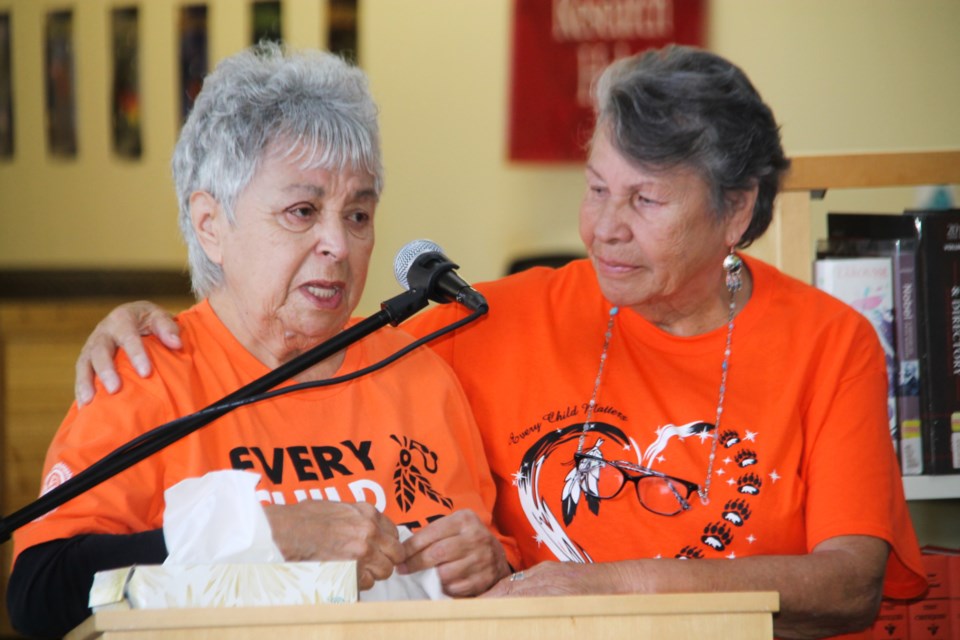 Jackie Fletcher and Shirley Horn - Shingwauk Indian Residential School survivors - speak at the official unveiling of a new plaque at Algoma University’s Arthur A. Wishart Library, September 30, 2022.