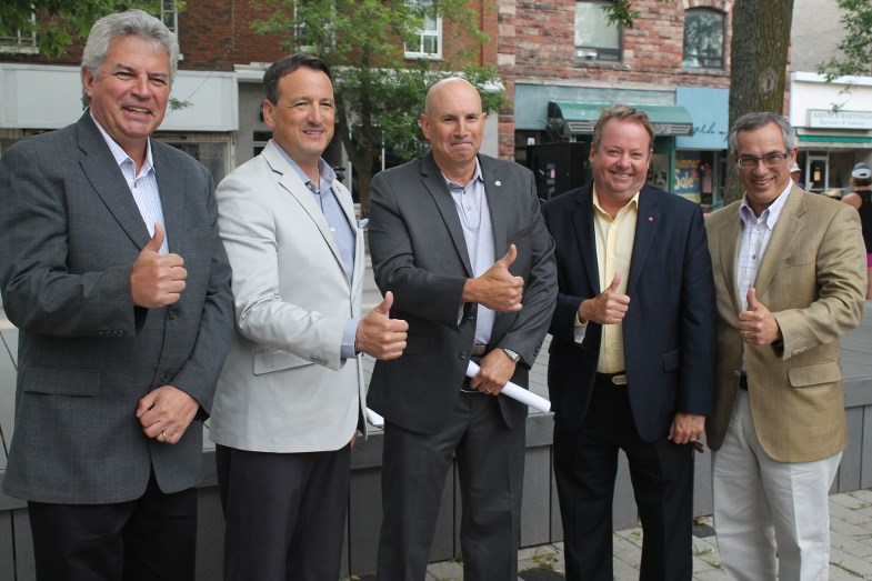 Sault MP Bryan Hayes, Minister Rickford, acting mayor Paul Christian, Nipissing-Timiskaming MP Jay Aspin and Minister Clement give a thumbs up following today's announcement.