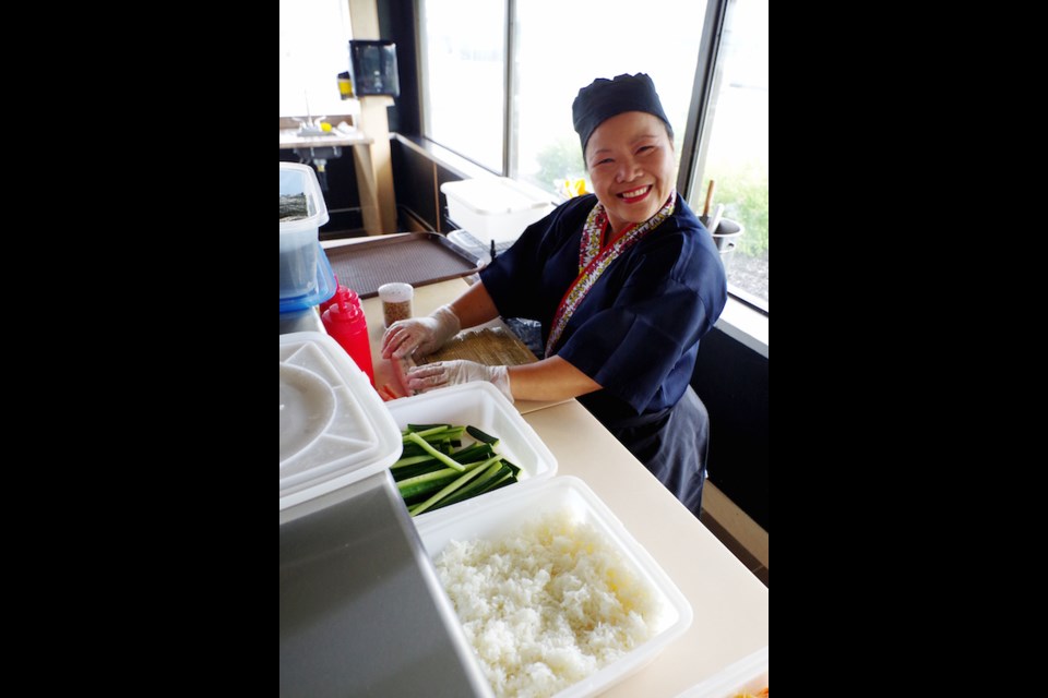 Chita Triplett prepares items for the sushi bar at Waterfront Legend. Michael Purvis/SooToday