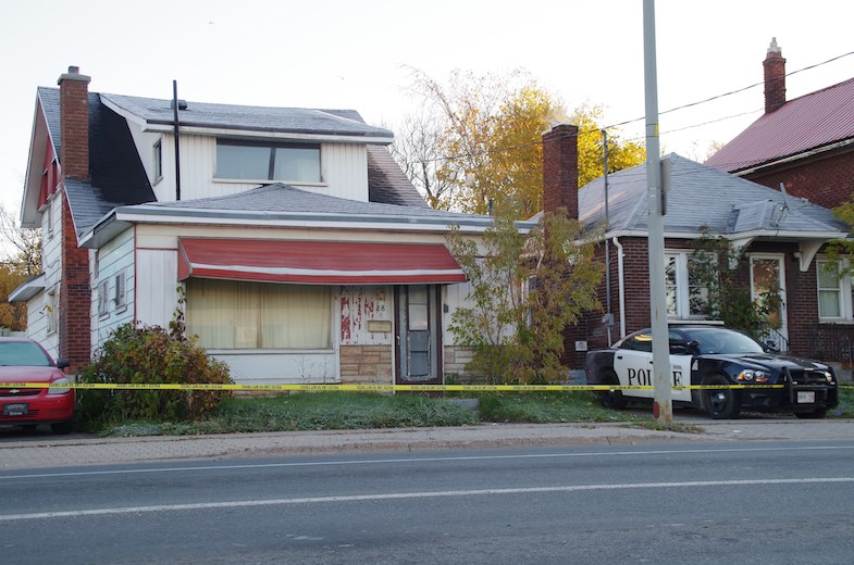 A Sault Ste, Marie Police Service cruiser sits between two Wellington Street East homes on the morning of Thursday, Oct. 23, 2014. Police reported that three suspects were sought after one man was taken to hospital with a gun shot wounds late Wednesday night.
Michael Purvis/SooToday