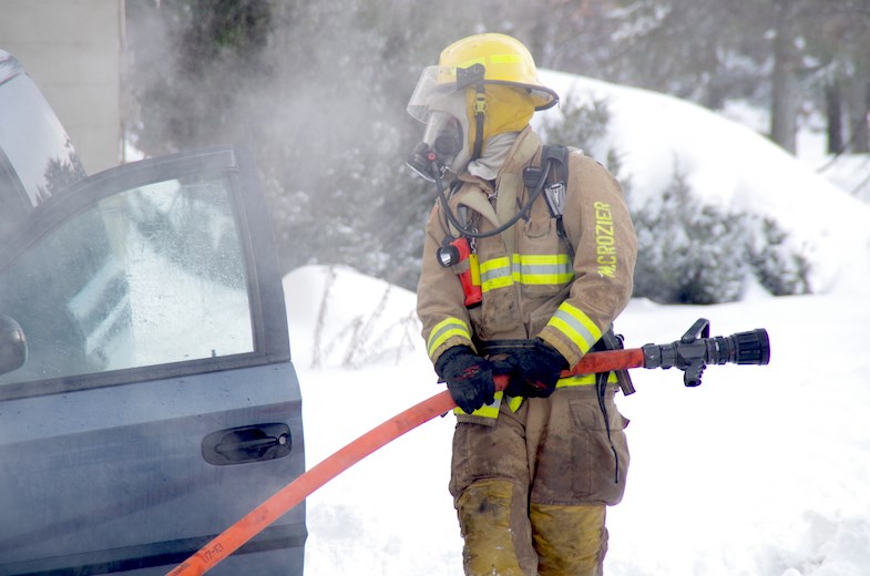 Firefighters douse a minivan fire in a parking lot at the corner of Spring Street and Foster Drive in Sault Ste. Marie, Ont. on Thursday, Nov. 20, 2014. No injuries were reported.
Michael Purvis/SooToday