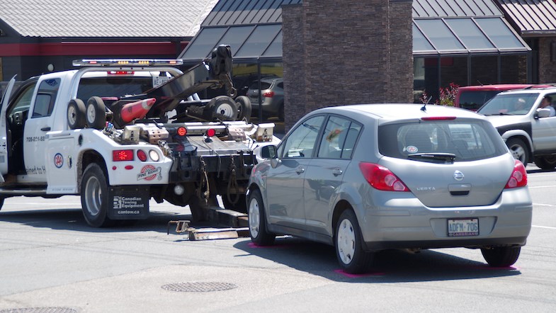A grey car is towed away from the scene of a two-vehicle collision. The other vehicle involved was a police cruiser. Police say an officer was taken to hospital with minor injuries.
Michael Purvis/SooToday