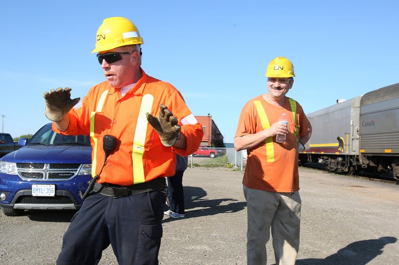 A CN worker dances prior to the ACR 100th anniversary trip from Sault Ste. Marie to Hearst, Ont. May 31, 2014. SooToday.com/Kenneth Armstrong