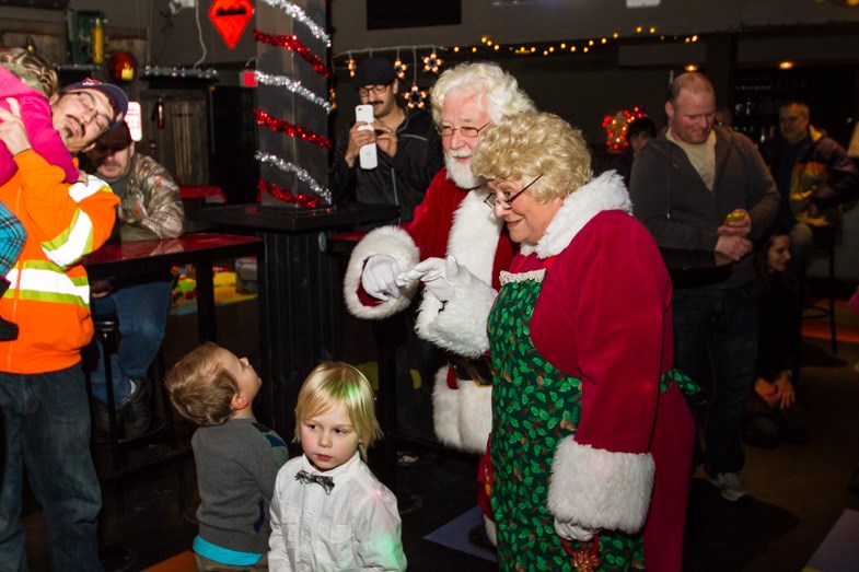 Santa and Mrs. Claus were greeted by a crowd of kids at the 3rd annual Toystock Christmas Cheer benefit at the Canadian Night Club on Sunday, November 30, 2014. Donna Hopper/SooToday