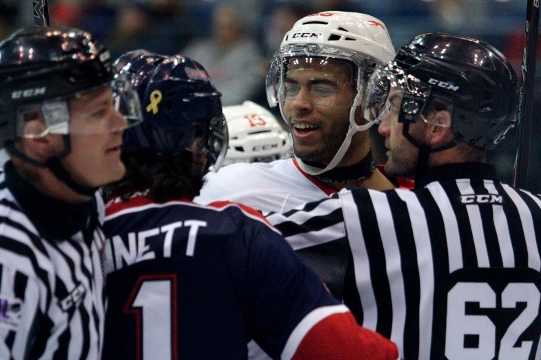 Referees break up a fight between Saginaw left winger Kris Bennett (11) and Sault Ste. Marie defenseman Darnell Nurse (25) during a first-round Ontario Hockey League playoff game between Saginaw and Sault Ste. Marie at the Dow Event Center in Saginaw, Tuesday, March 31, 2015. Sault Ste. Marie leads the series 3-0. David C Bristow/MLive.com
