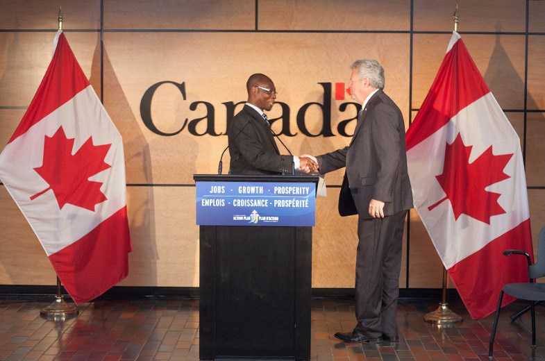Dr. David Nanang, director general of Canadian Forest Service, welcomes MP Bryan Hayes during an announcement at the GLFC on Tuesday. Kenneth Armstrong/SooToday