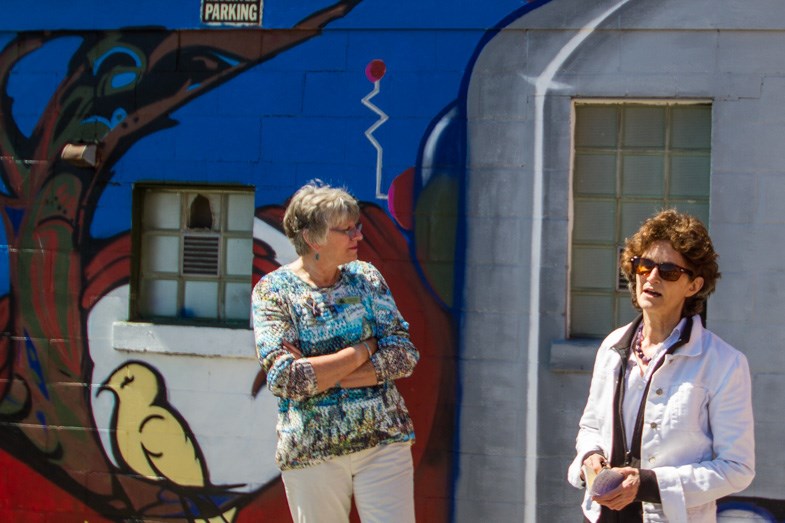 City Councillor Susan Myers and Jude Ortiz discuss the Graffiti Reframed mural reveal Wednesday, July 22, 2015. Donna Hopper/SooToday