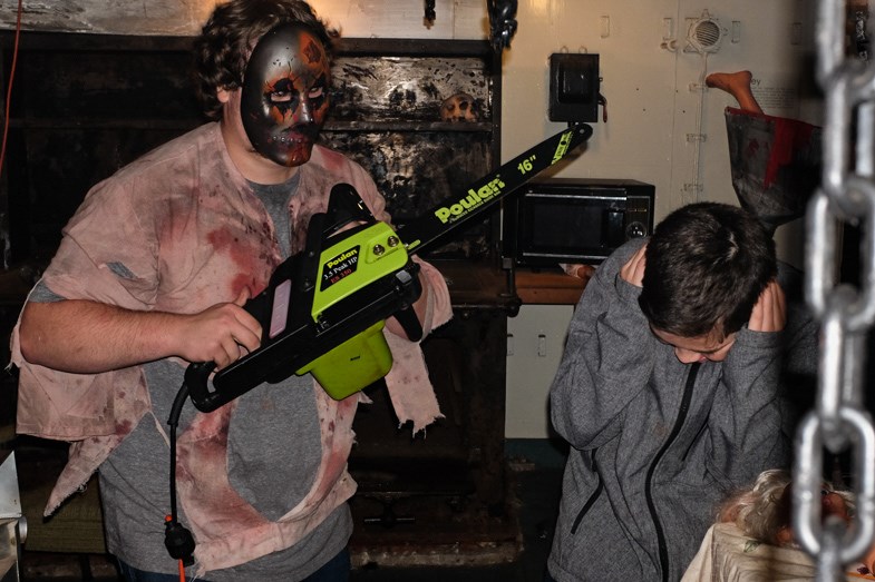 The chainsaw was actually plugged in. There was no chain but who could really tell? Dozens of high school students dressed up and volunteered their time to raise money for charity at the MS Norgoma Haunted Ship tour. Photo by Jeff Klassen