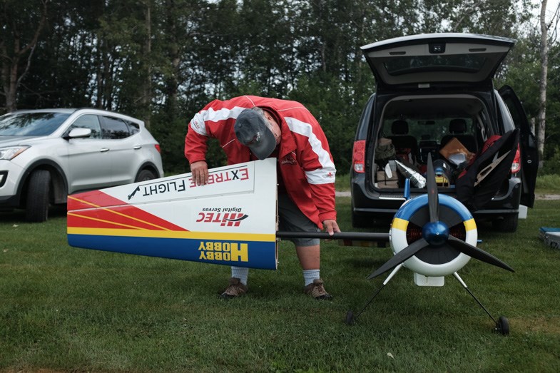 Jim Daly of Mississauga prepares his Extreme Flight Yak 54 at the Northern Ontario International Miniature Aerobatic Club Challenge (NOIC) on Saturday August 1, 2015 in Sault Ste. Marie, ON. Jeff Klassen for SooToday.