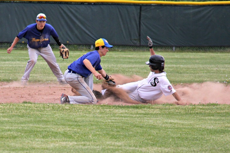 Connor Henderson of the Soo Black Sox slides into second base during semi-final action of the Black Sox Invitational