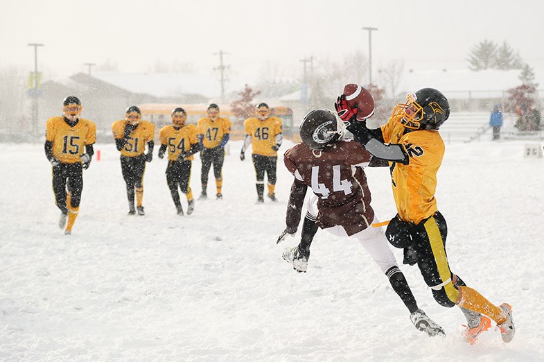 Lively Hawks player Andrew Elliot attempts to catch a pass during the second half of the NOSSA Junior football championship game against the Korah Colts played November 18, 2014 in Sault Ste. Marie, Ont.  Kenneth Armstrong/SooToday