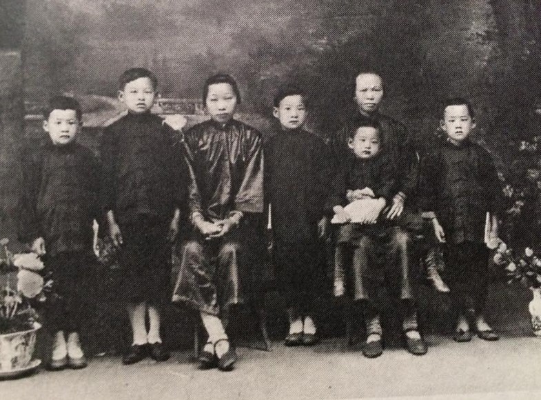 Lewis Chow is shown second from left, in this portrait taken in China after his mother died in 1925. His brother King is at the far left.