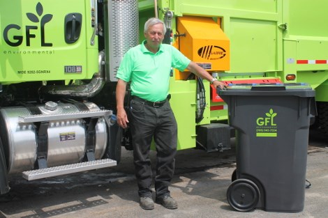 GFL's Health and Safety Supervisor Randy Roy with new bin