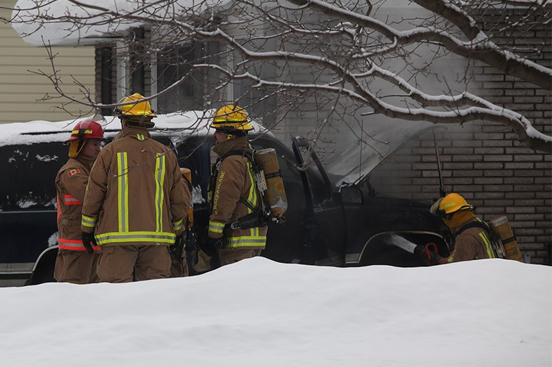 Firefighters extinguish a car fire Thursday morning on Allens Side Road. Kenneth Armstrong/SooToday