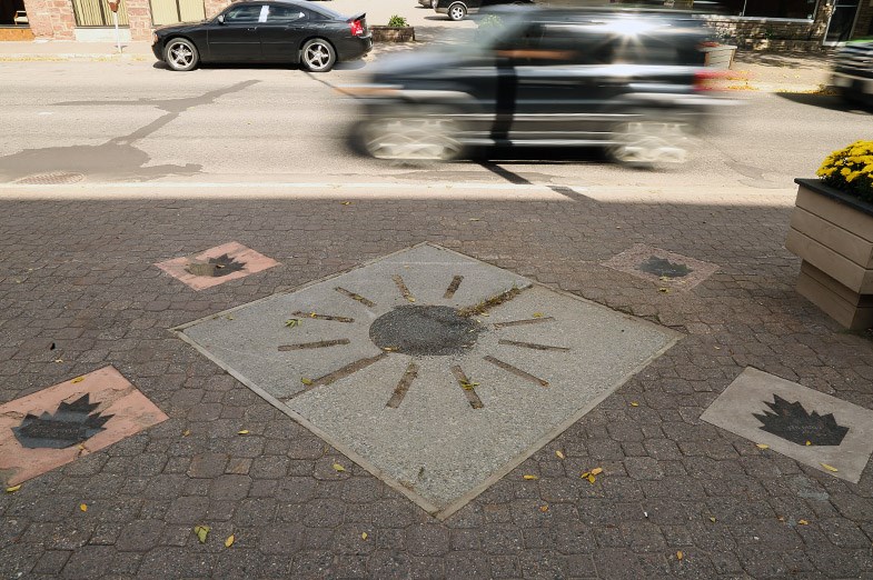 Sault Ste. Marie Walk of Fame sidewalk markers are seen September 22, 2014 on Queen Street. Many of the markers have become damaged due to climate and snow removal efforts. Kenneth Armstrong/SooToday