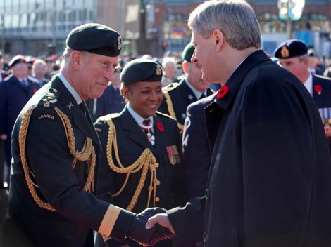 Prime Minister Stephen Harper greets His Royal Highness the Prince of Wales at the Remembrance Day Ceremony held at the National War Memorial.