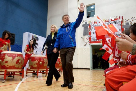 Prime Minister Stephen Harper and his wife Laureen visit with children at the Canadian International School of Beijing.