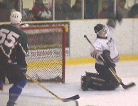 Tulloch Engineering goaltender Jeff Grisdale makes a late game save to preserve his championship game shutout.