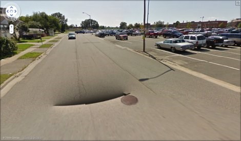 Hi SooToday.com:  I was browsing through the new Google Street View just now, and noticed something very strange near the corner of West Street and Albert Street - a black hole!  I attached the screen shot I took of it.  Thanks,  - Amy DiNardo
