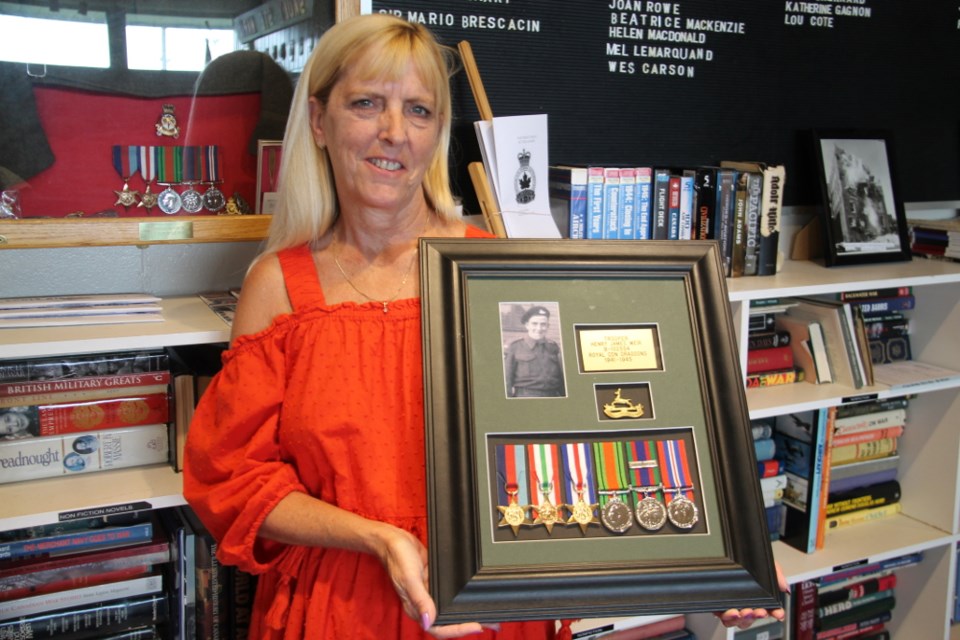 The Sault’s Margaret Durkee with her father Henry Weir’s recovered Second World War items.  The items were lost, but discovered and handed over to Royal Canadian Legion Branch 25.  Darren Taylor/SooToday