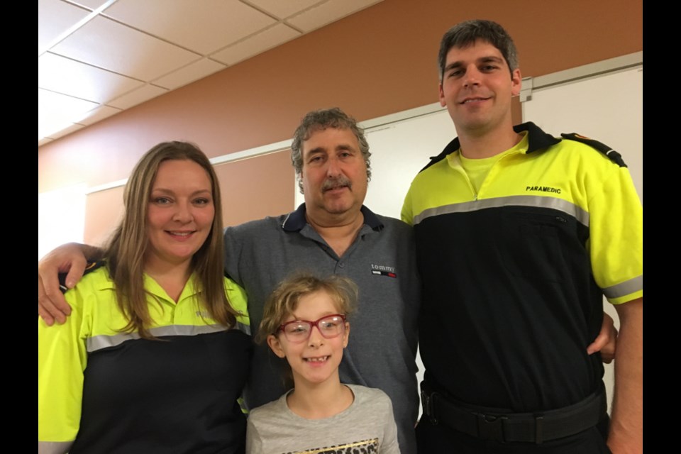 Sault paramedics Kara Ribic and Adam Bering with Gene Biocchi and his daughter Julia at the Emergency Services Complex at 65 Old Garden River Road, Friday Oct. 20, 2017. Biocchi personally thanked Ribic and Bering for bringing him back from the brink of death in May. Darren Taylor/SooToday
