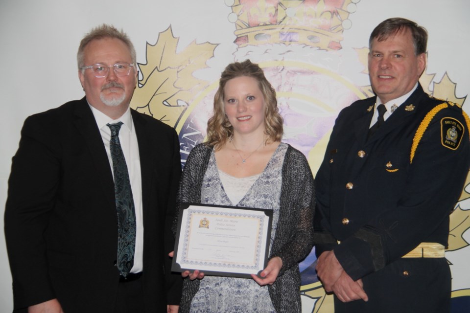 Alissa Begin, a Sault Area Hospital (SAH) social worker, with Rick Webb, Sault Ste. Marie Police Services Board member and Robert Keetch, Sault Ste. Marie Police Service chief, at the 32nd Annual Police Community Programs Night, Feb. 27, 2018. Darren Taylor/SooToday