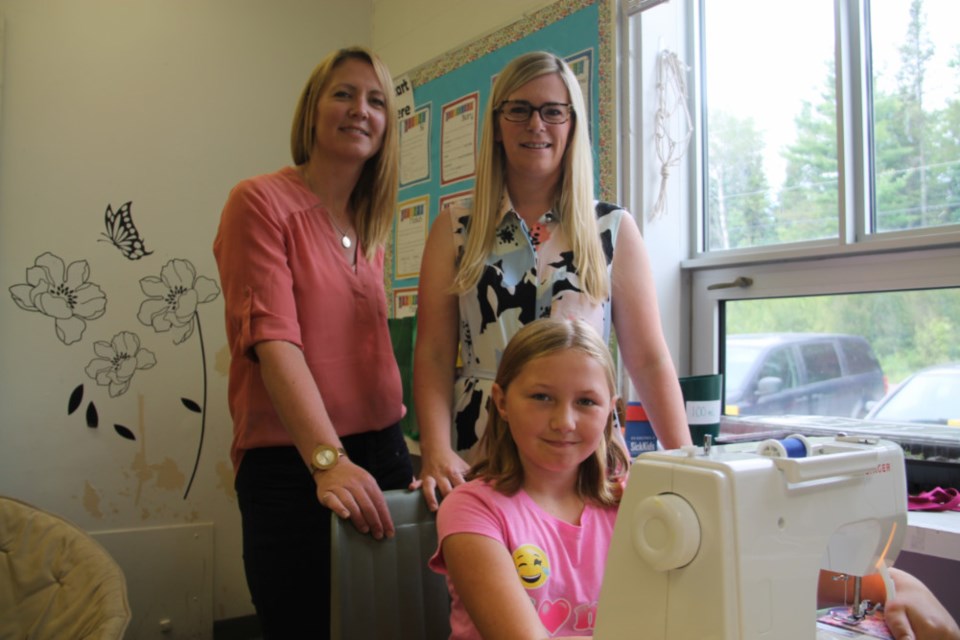 Mountain View Public School teachers Nikki Burke and Melissa Rains-Vanderburg with student Brooke Irving, one of a group of students sewing dresses for African girls in need, June 28, 2018. Darren Taylor/SooToday