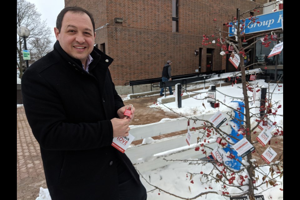 Sault Mayor Christian Provenzano picks up his free lock to show support for people living with HIV, Nov. 29, 2019. Darren Taylor/SooToday    