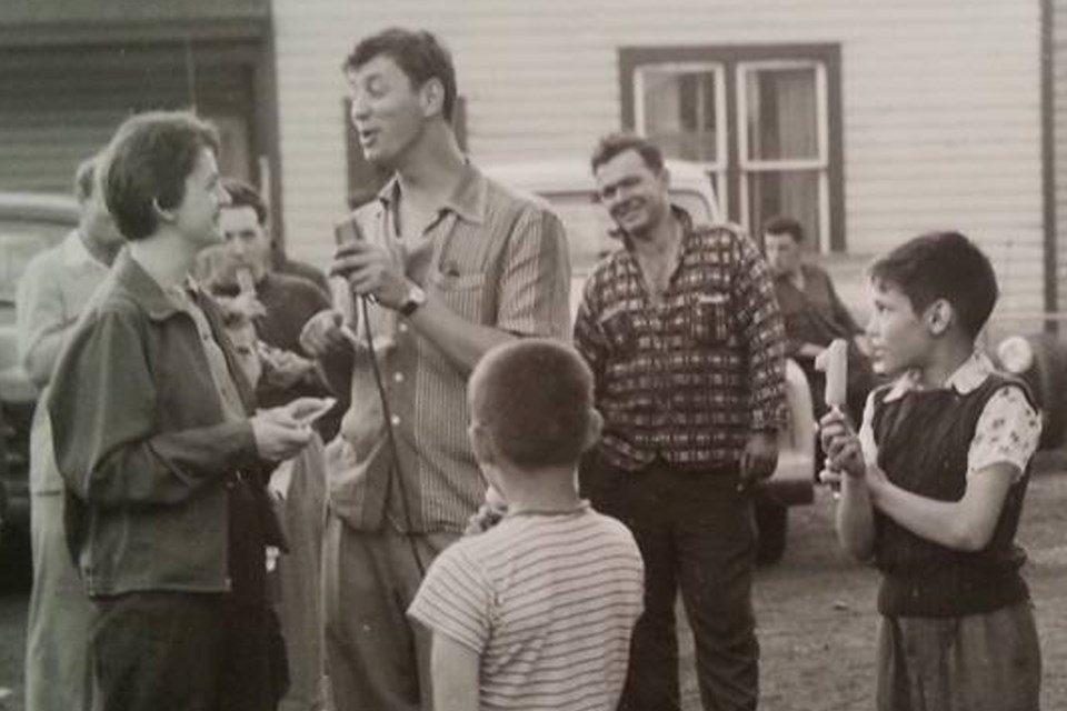 Uncharacteristically mustacheless, a young George Jonescu waxes eloquent during a CJIC remote broadcast in 1950s Sault Ste. Marie