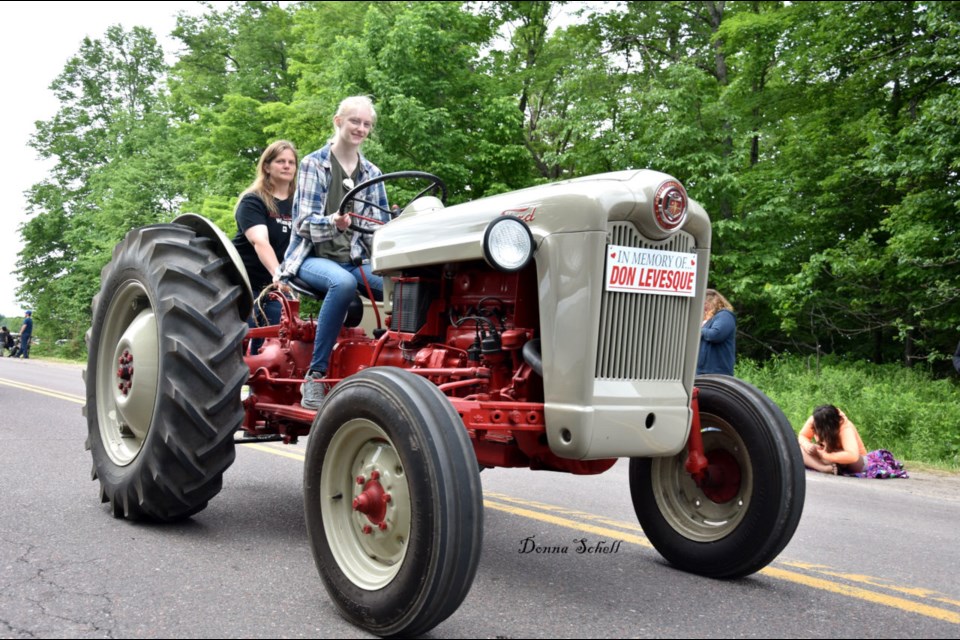 Don Levesque's granddaughter, Rylie Broks, driving his tractor with her mother and Don's daughter, Erin Broks. Donna Schell for SooToday