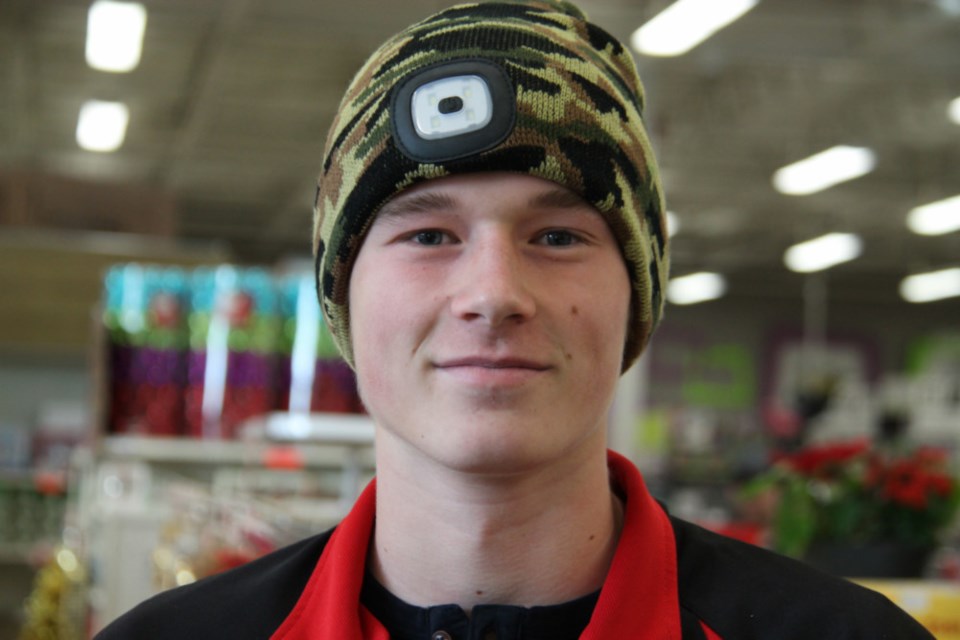 Noah Grasley models an Ultra Bright LED hat, equipped with a LED head lamp, available at Canadian Tire, Dec. 22, 2018. Darren Taylor/SooToday