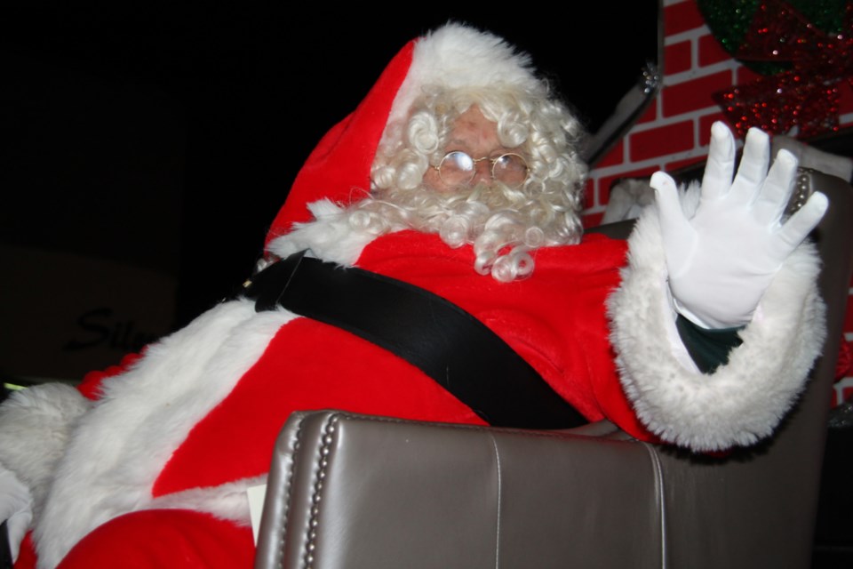 Santa Claus waves to the crowds lined along Queen Street, Nov. 23, 2019. Darren Taylor/SooToday