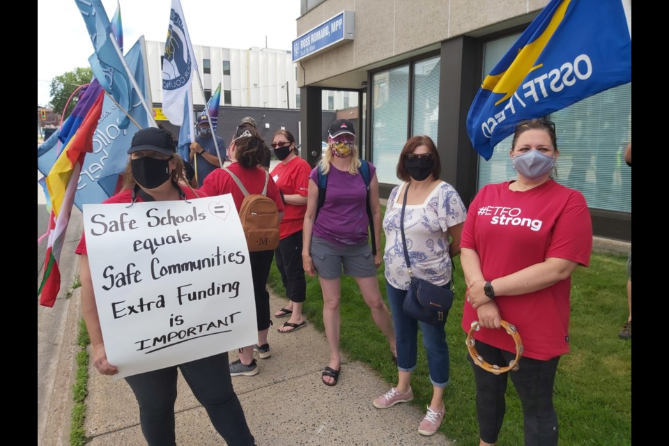 Unionized teachers and parents gathered outside Sault MPP Ross Romano’s office with concerns about funding and safety in the face of a possible return to school in the fall for children and teachers, July 29, 2020. Darren Taylor/SooToday 