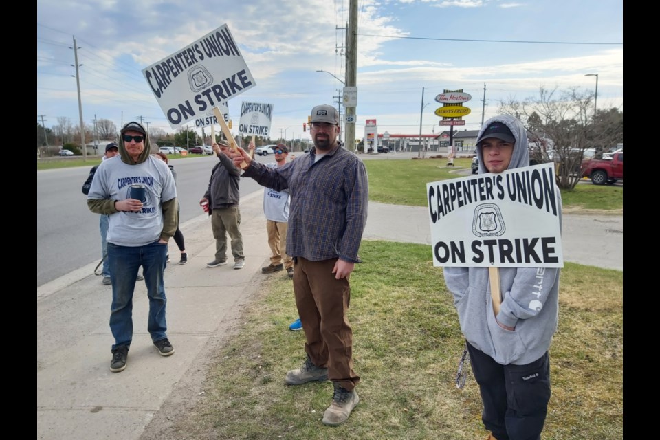 Striking United Brotherhood Of Carpenters & Joiners Of America Local 2486 workers near the union office on Trunk Road, May 9, 2022.
