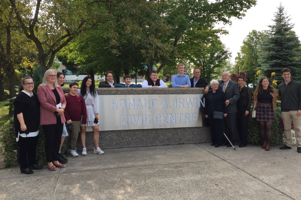 Members of Irwin family join Marg and Ron Irwin (fourth and fifth from right) at unveiling of new sign at the CIvic Centre. David Helwig/SooToday 