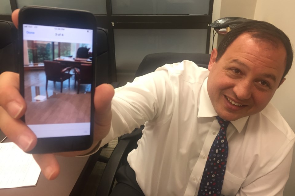 Mayor Christian Provenzano shows SooToday the first email he got this morning from his assistant Lisa Bell, showing some of the water she found in his office after a partial ceiling collapse. David Helwig/SooToday 