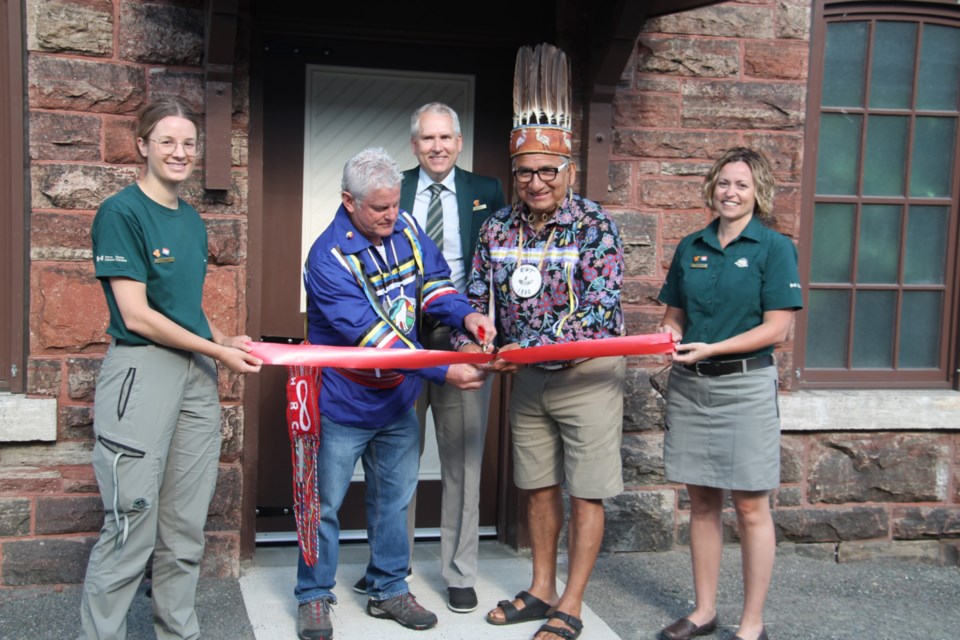 Steve Gjos, Region 4 of Metis Nation of Ontario Captain of the Hunt and Dean Sayers, Batchewana First Nation chief cut the ribbon at the official opening of the Sault Ste. Marie Canal Visitor Centre, accompanied by Carly Wetzl, Sault Ste. Marie Canal National Historic Site acting site manager, Jonathan Arnold, Parks Canada acting executive director for Ontario and Sharon Hayes, Parks Canada field unit superintendent for northern Ontario, June 24, 2022.