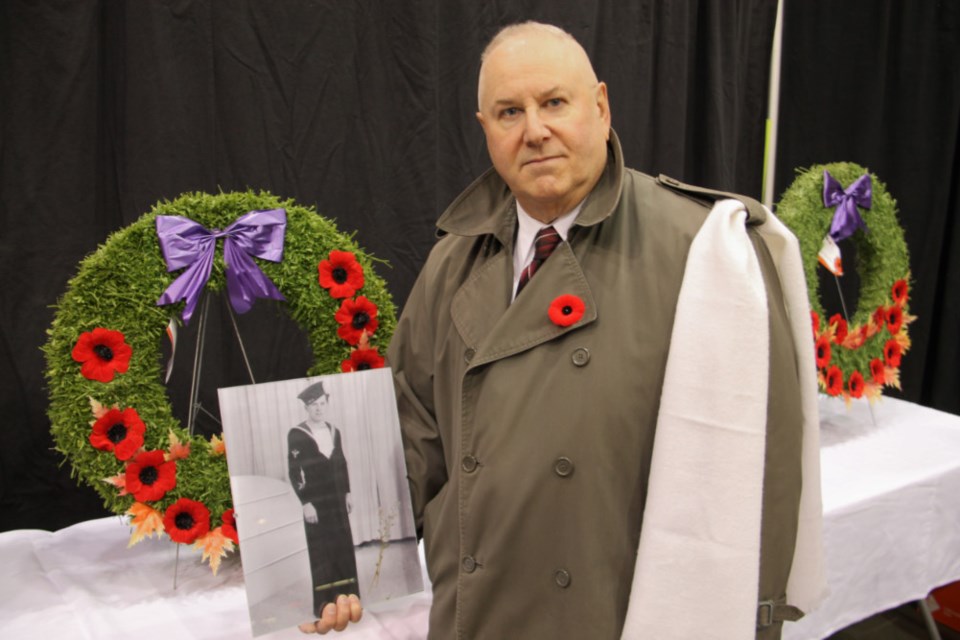 Robert Wrona with a photo of his veteran father Louis Wrona at the March for a Veteran event during Remembrance Day ceremonies at GFL Memorial Gardens, Nov. 11, 2018. Darren Taylor/SooToday