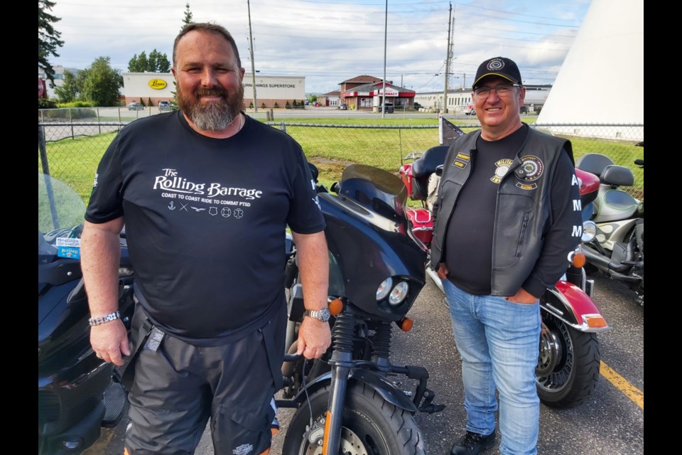 Paul Harman, Rolling Barrage biker/official and James Seaton, local Barrage supporter, August 8, 2022.