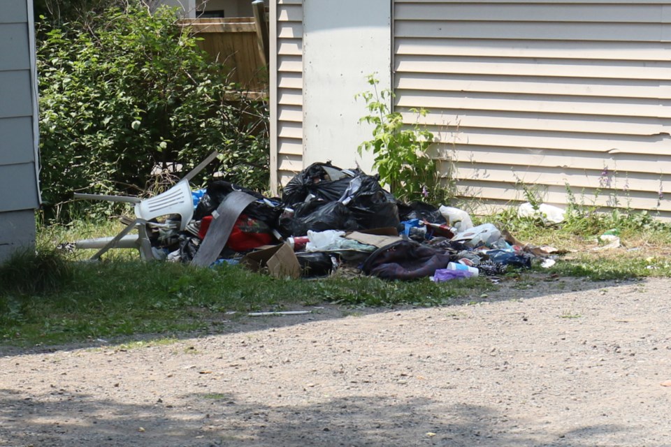 Audrey Crack has filed a complaint against an Albert Street East property owner for leaving garbage strewn about the yard. The City of Sault Ste. Marie has issued the property owner an order to clean the yard. 