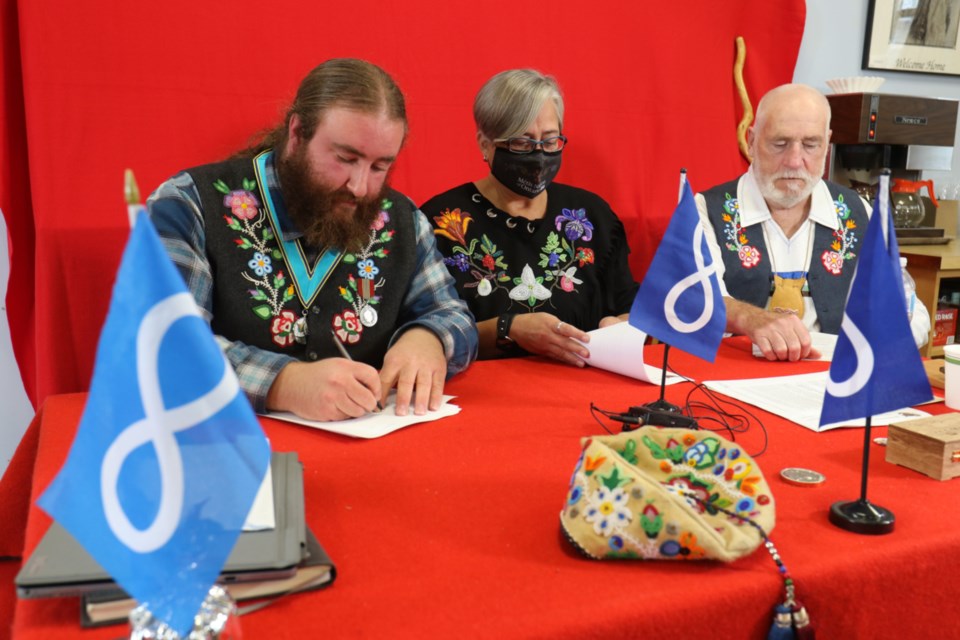 Mitch Case, Region 4 Councilor for the Provisional Council of the Métis Nation of Ontario, left, was joined by Métis Nation of Ontario President Margaret Froh and Métis Elder Art Bennet in Sault Ste. Marie Oct. 21 to sign a letter calling on the government for a formal lands claim process. 