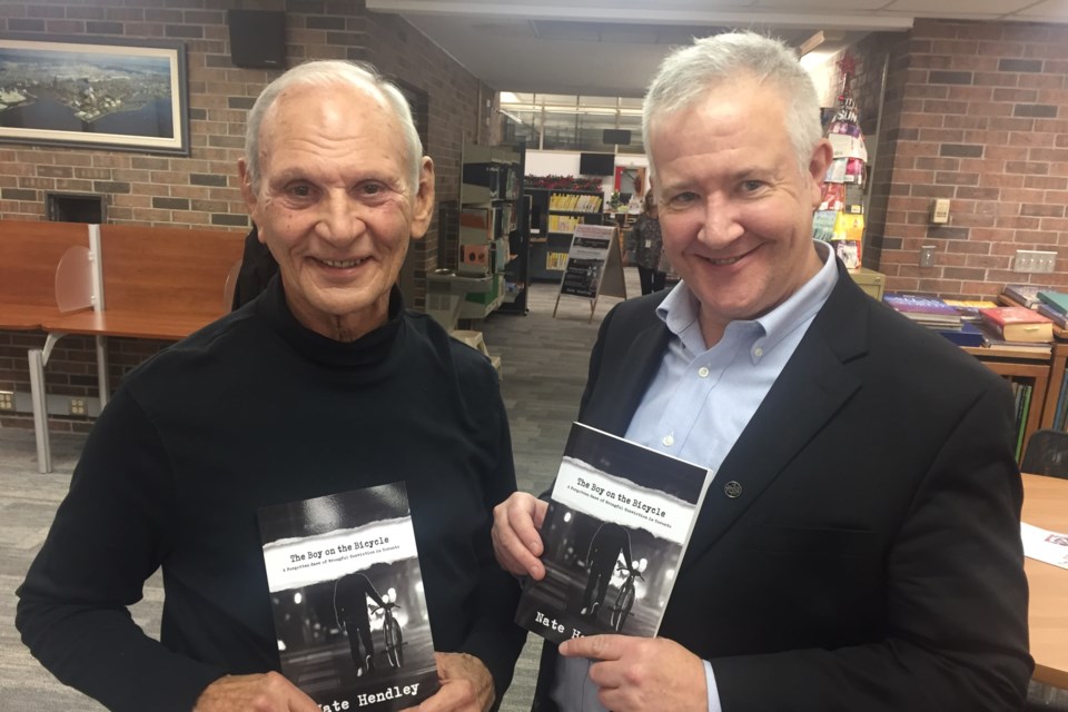 Ron Moffatt with true-crime author Nate Hendley at James L. McIntyre Public Library on Nov. 24, 2018. David Helwig/SooToday