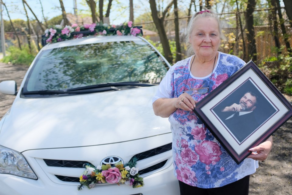 15 years ago, Carolyn Chisholm started putting flowers on her car to cheer up patients on dialysis, including her husband Walter Chisholm Jr.. Ever since Walter died in 2005, she has continued doing it in his honour. Jeff Klassen/SooToday 
